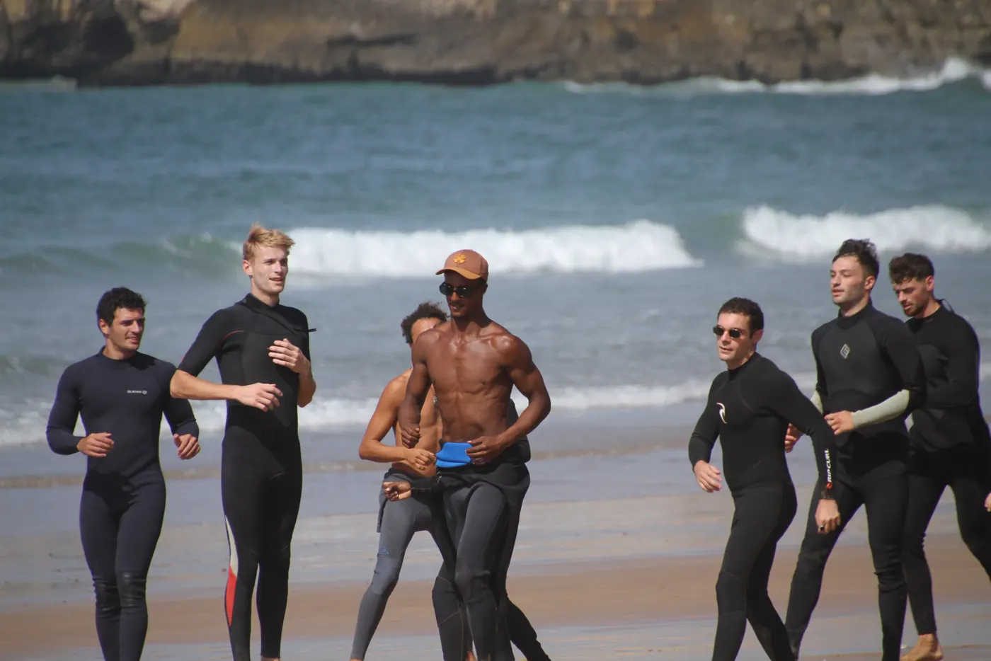 Chafik walking out of the water with his surfers